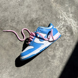 Looped Laces Light Pink rope shoelaces tied in Nike Dunk Low University Blue sneaker on side